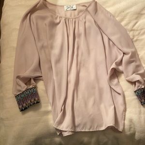 VaVa blouse with sleeve embellishments. Size medium. Loose fitting.